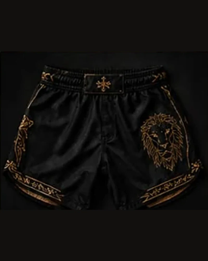 Black performance shorts with ornate gold details